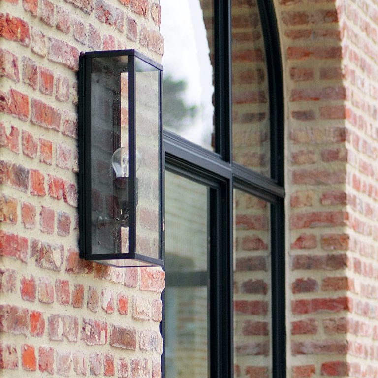 Cased wall light on the brick fa&ccedil;ade of the Gmund paper mill