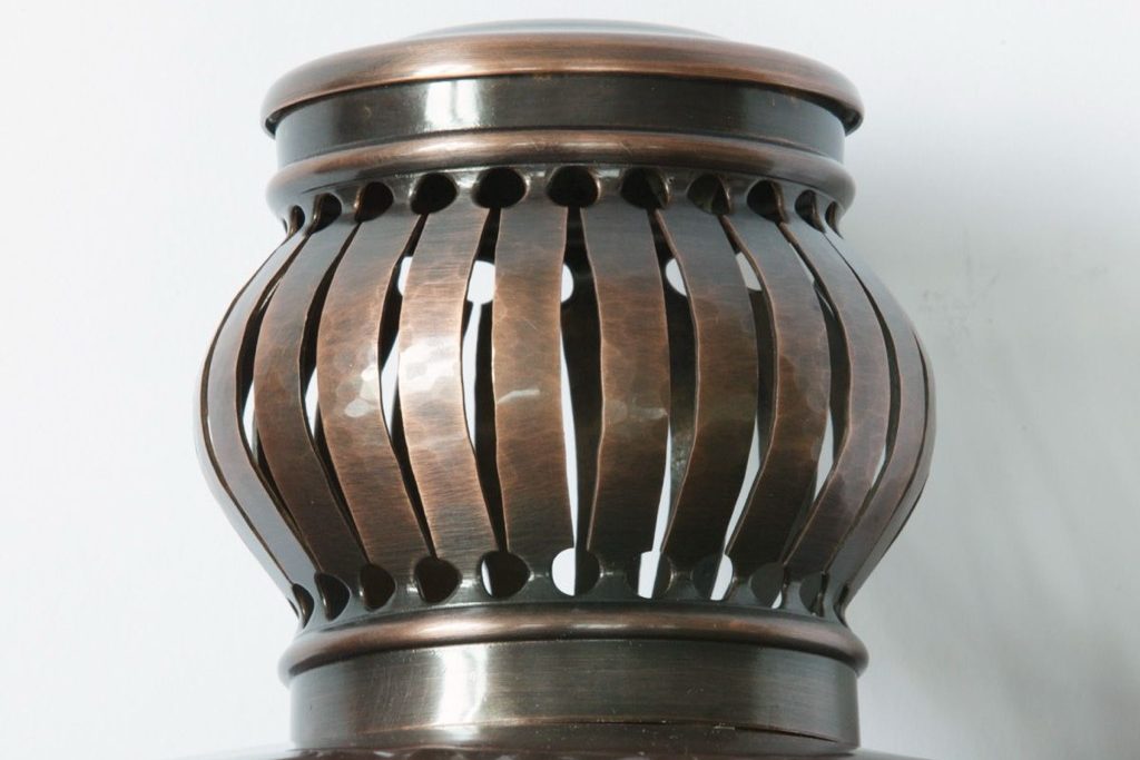 Hammered copper lantern crown with pierced vents